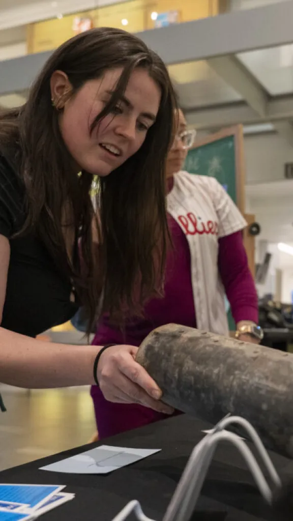 visitor inspects a fireworks shell