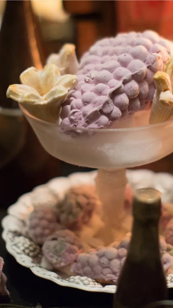 a bunch of grapes molded out of purple grape ice cream