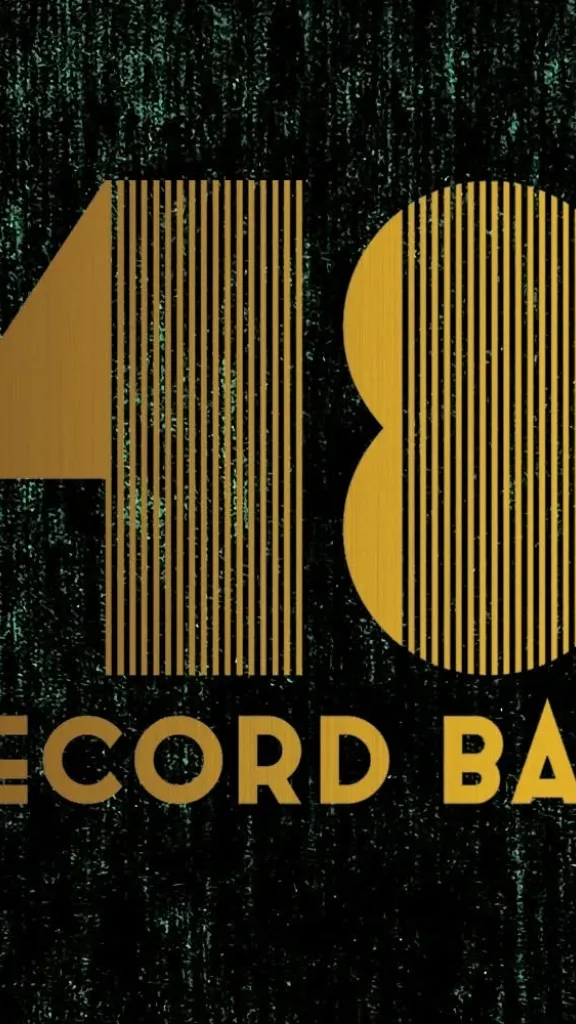 A logo for 48 Record Bar featuring gold letters on a black background