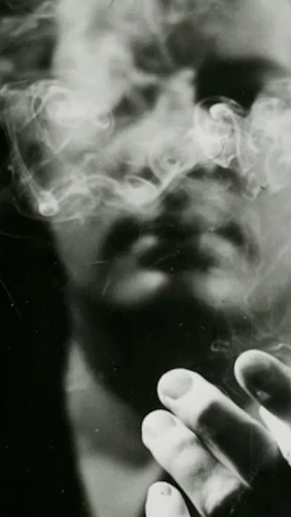 black and white image of a man smoking