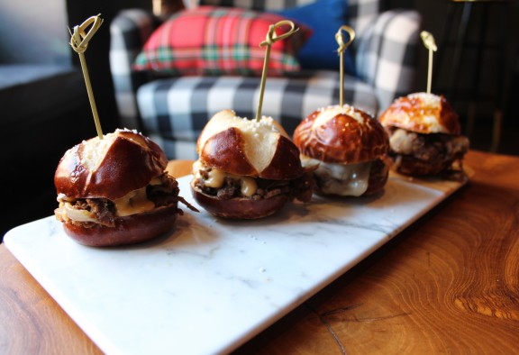 Four sliders on a plate at Kick Axe Throwing