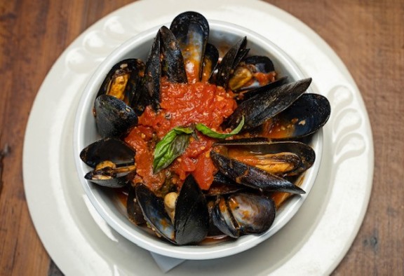 Mussels in white bowl on display at Spasso Italian Grill