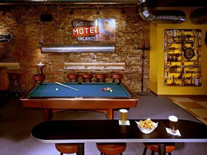 interior of Buffalo Billiards, with a pool table and snacks and drinks on a table