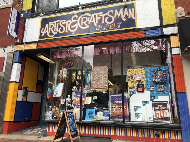 Exterior of Artist & Craftsman Supply, with front entrance and large window display