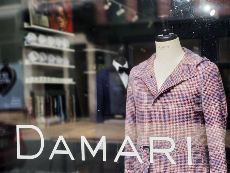 Clothing on display in front window at Damari