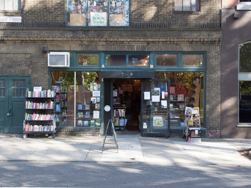 Exterior photo of The Book Trader shop on N. 2nd Street in Old City, Philadelphia with books on display outside and in front windows