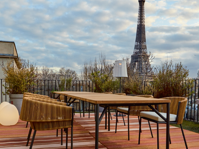 Outdoor furniture in Paris with Eiffel Tower in background