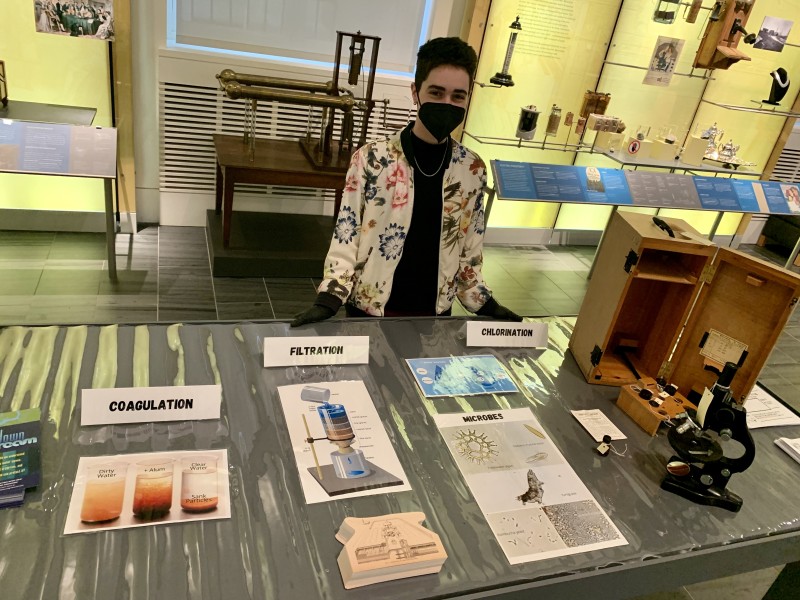 Person standing at display table at Science History Institute