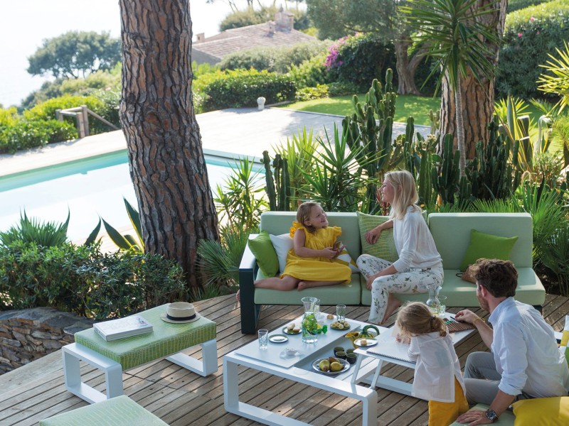 People sitting on outdoor furniture