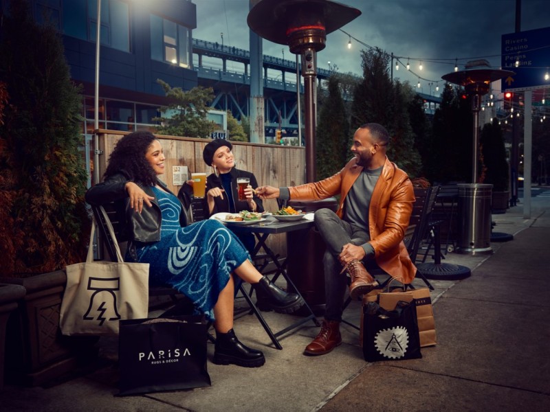 Three people dining outdoors at Race Street Cafe