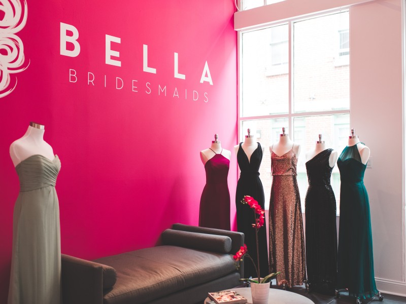 Six bridesmaids dresses on display on mannequins inside Bella Bridesmaids shop