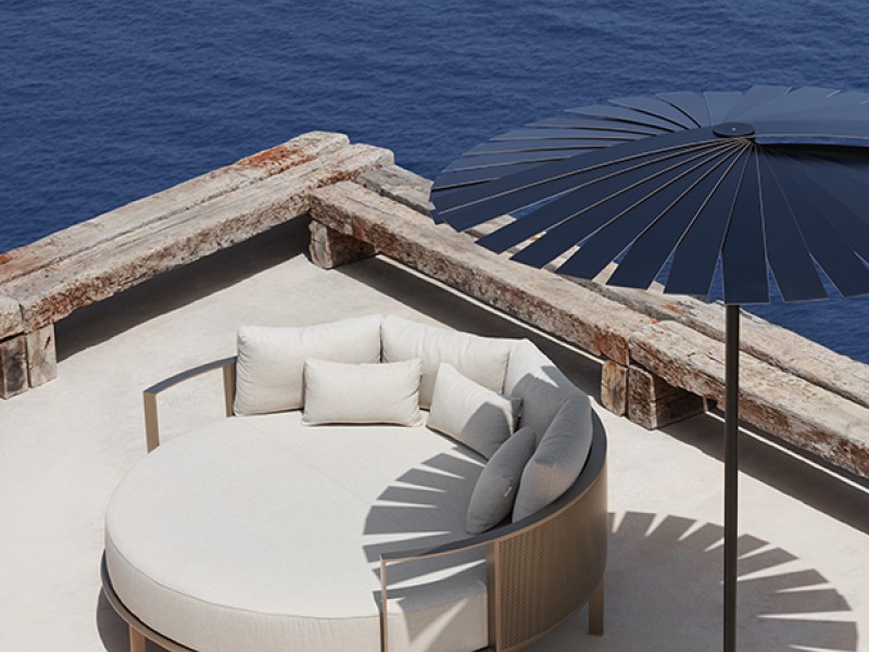 Outdoor furniture on patio along waterfront