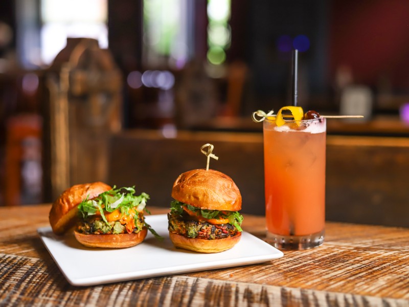 Two sliders and a drink on display at National Mechanics