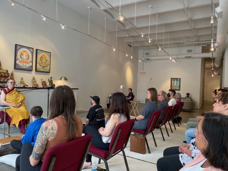 People sitting in a room for open house 