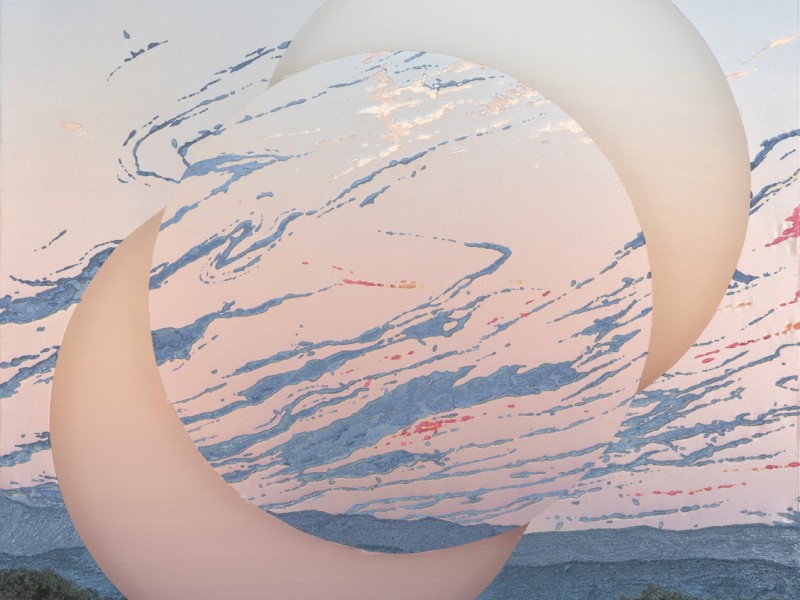 Artwork of two moons over landscape
