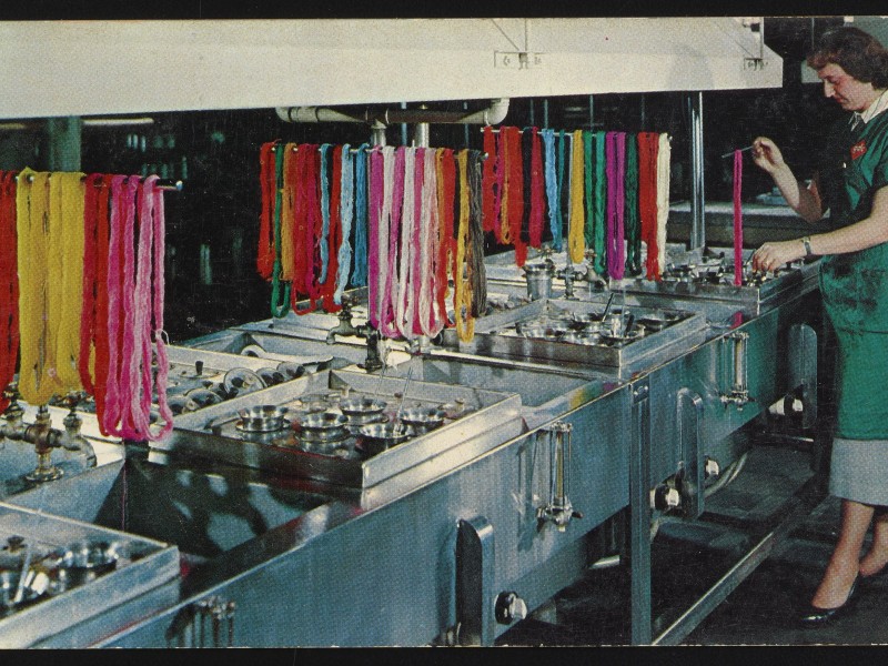 Old picture of someone handling fibers 