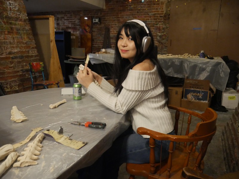 Image of Ministry of Awe First Friday participant, sitting at a table and making art.