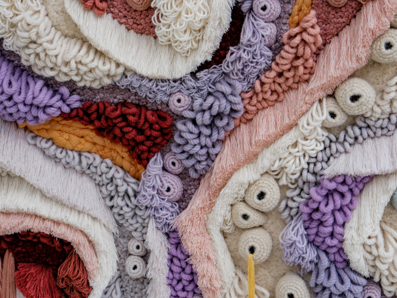 Close up of color fibers tapestry made to look like coral reef