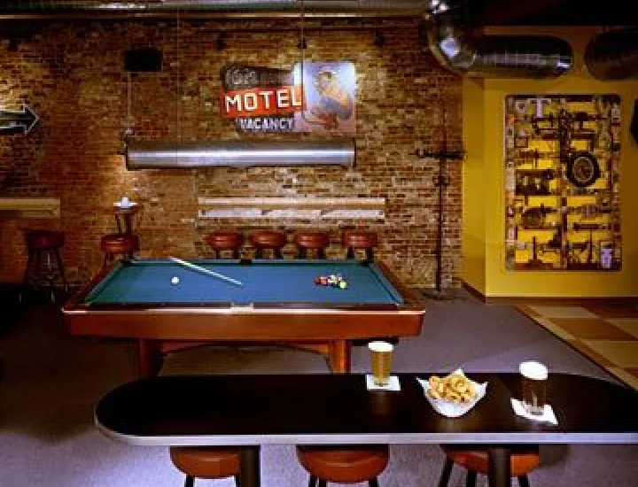 interior of Buffalo Billiards, with a pool table and snacks and drinks on a table