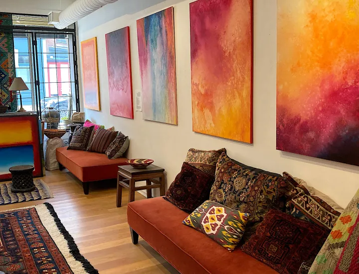 Interior of Gallery51 with artwork on walls and furniture and furnishings on display