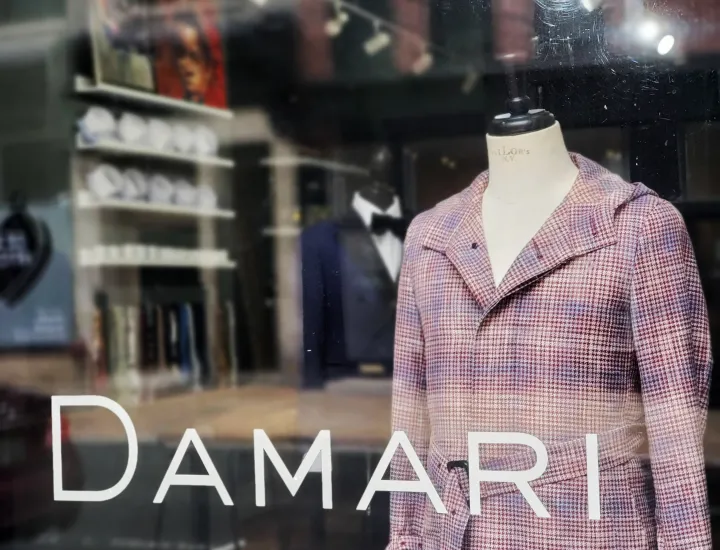 Clothing on display in front window at Damari
