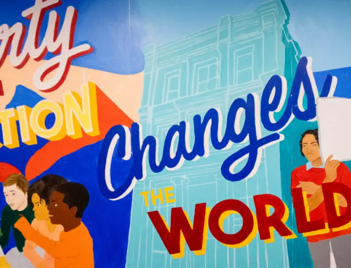 Mural at national Liberty Museum that reads "Liberty in Action Changes the Word"