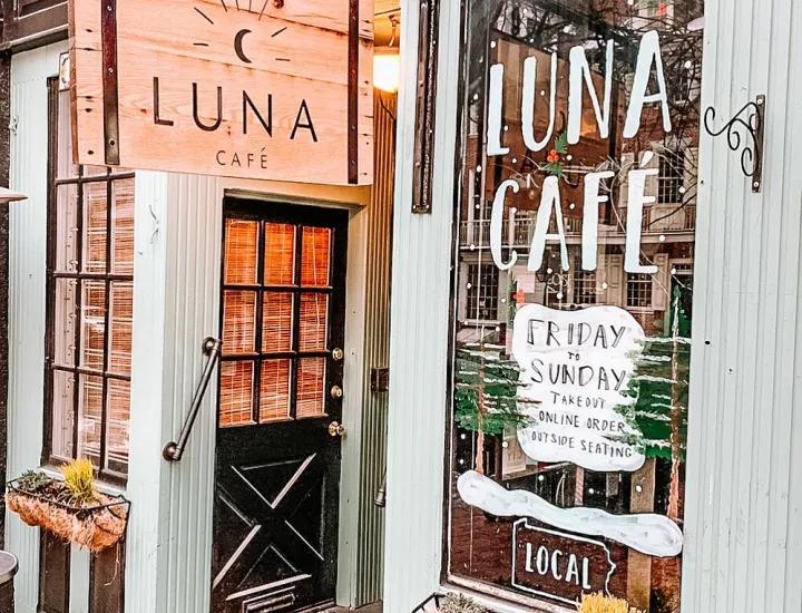 Exterior of Luna Cafe with signage and front display window