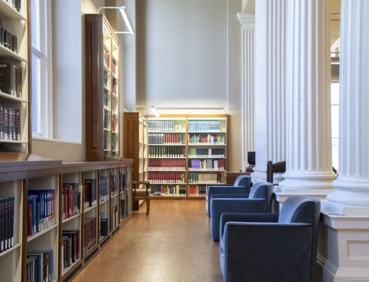 library scene with armchairs and columns