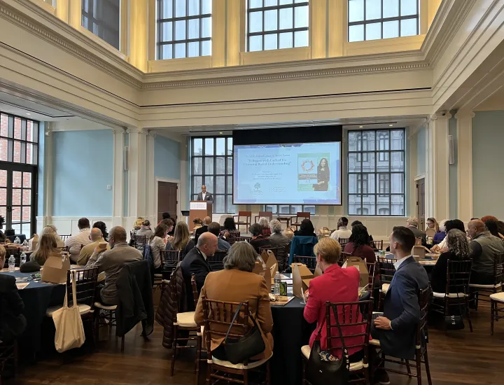 crowd of people sitting in a conference hall