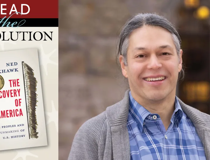 Graphic of book to the left of man with grey hair, blue shirt, and grey sweater