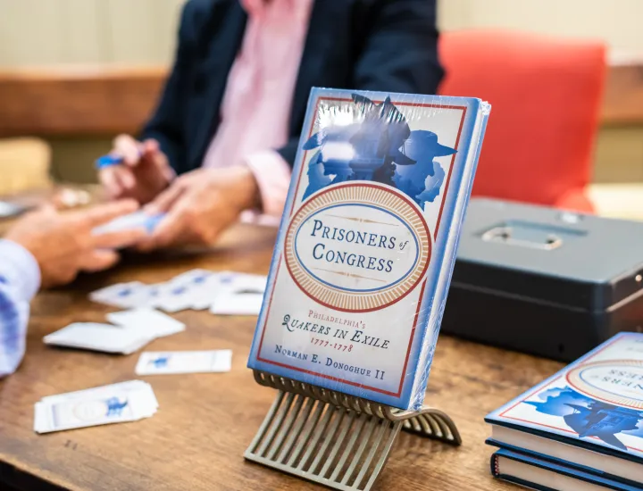 Image of author Norman Donoghue at a signing of his book, Prisoners of Congress.