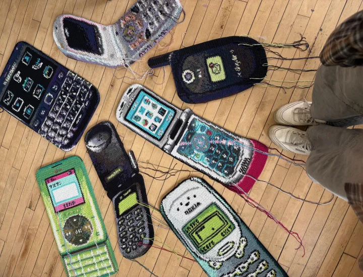 Collection of oversized crochet cell phones from early 2000's