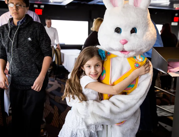 Child hugging Easter Bunny