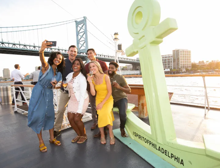 Group taking photo on boat.
