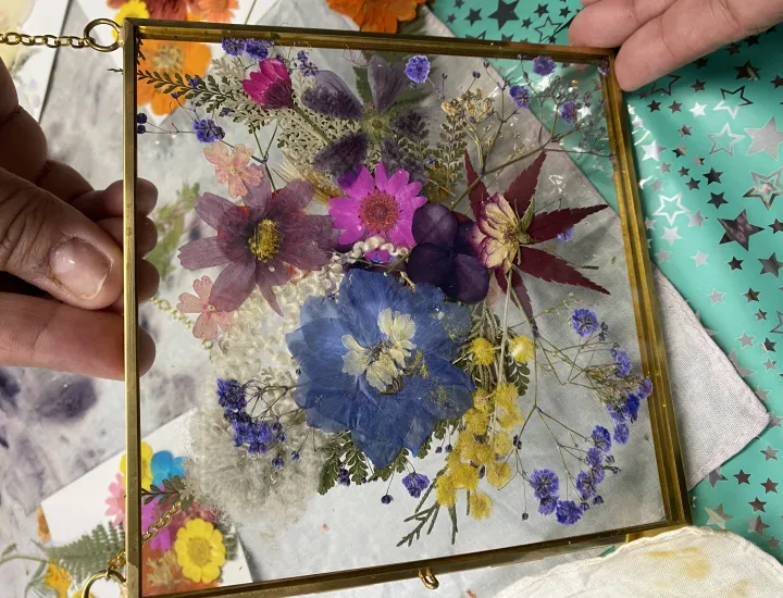 Workshop participant showing off her botanical design 