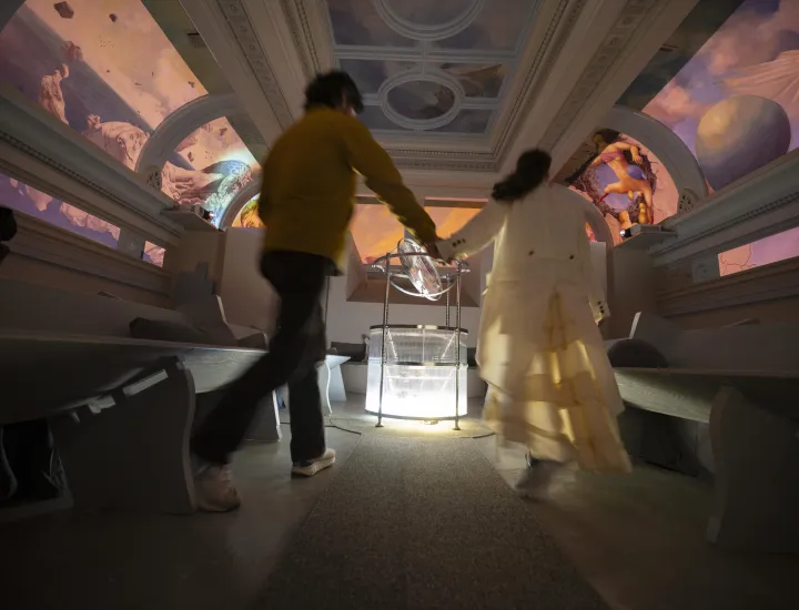 A Priestess in The Heavens guides a visitor through the space painted by Meg Saligman with interactions created by Spatial Pixel artists (Violet Whitney and William Martin).