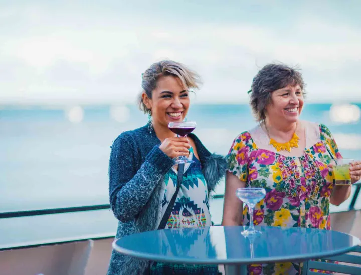 Ladies enjoying drinks on boat