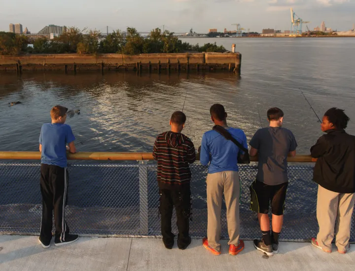 Group of friends fishing at Pier 68