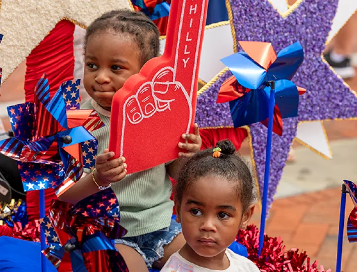 Two children with patriotic decor