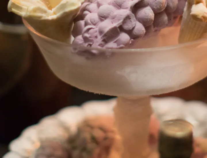 a bunch of grapes molded out of purple grape ice cream
