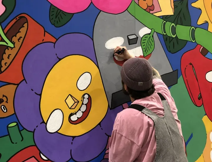 Artist Mr. Scooots painting a mural in Philadelphia