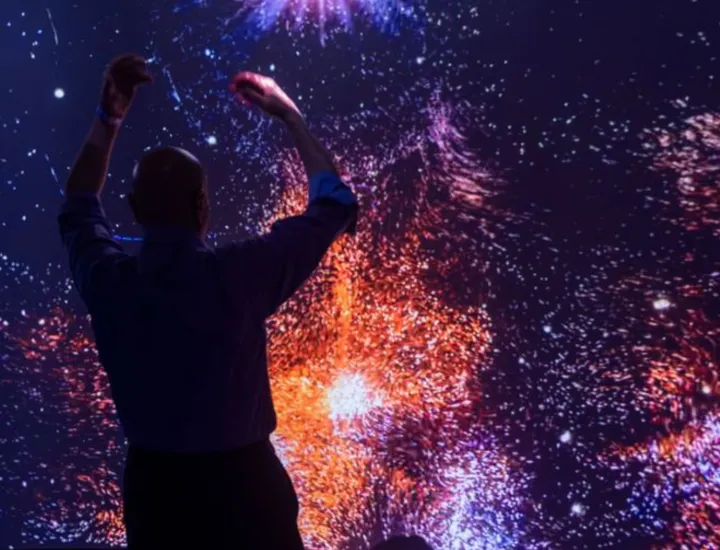 Photo of visitor interacting with immersive Colors fo Creation space.