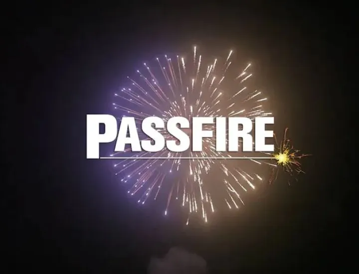 purple and yellow firework exploding over black with the word "Passfire" overlaid