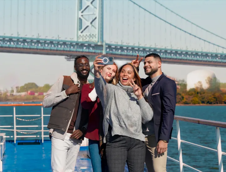 people taking selfie on boat