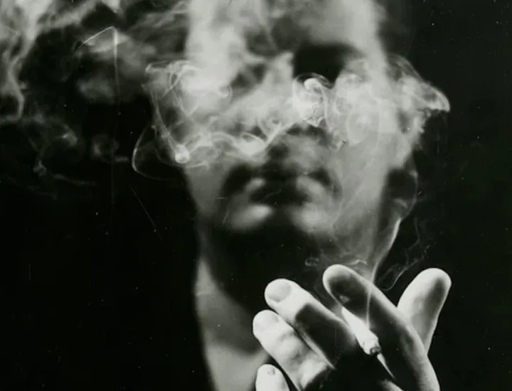black and white image of a man smoking